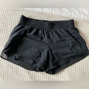 Athleta black mesh racer run shorts 4”
